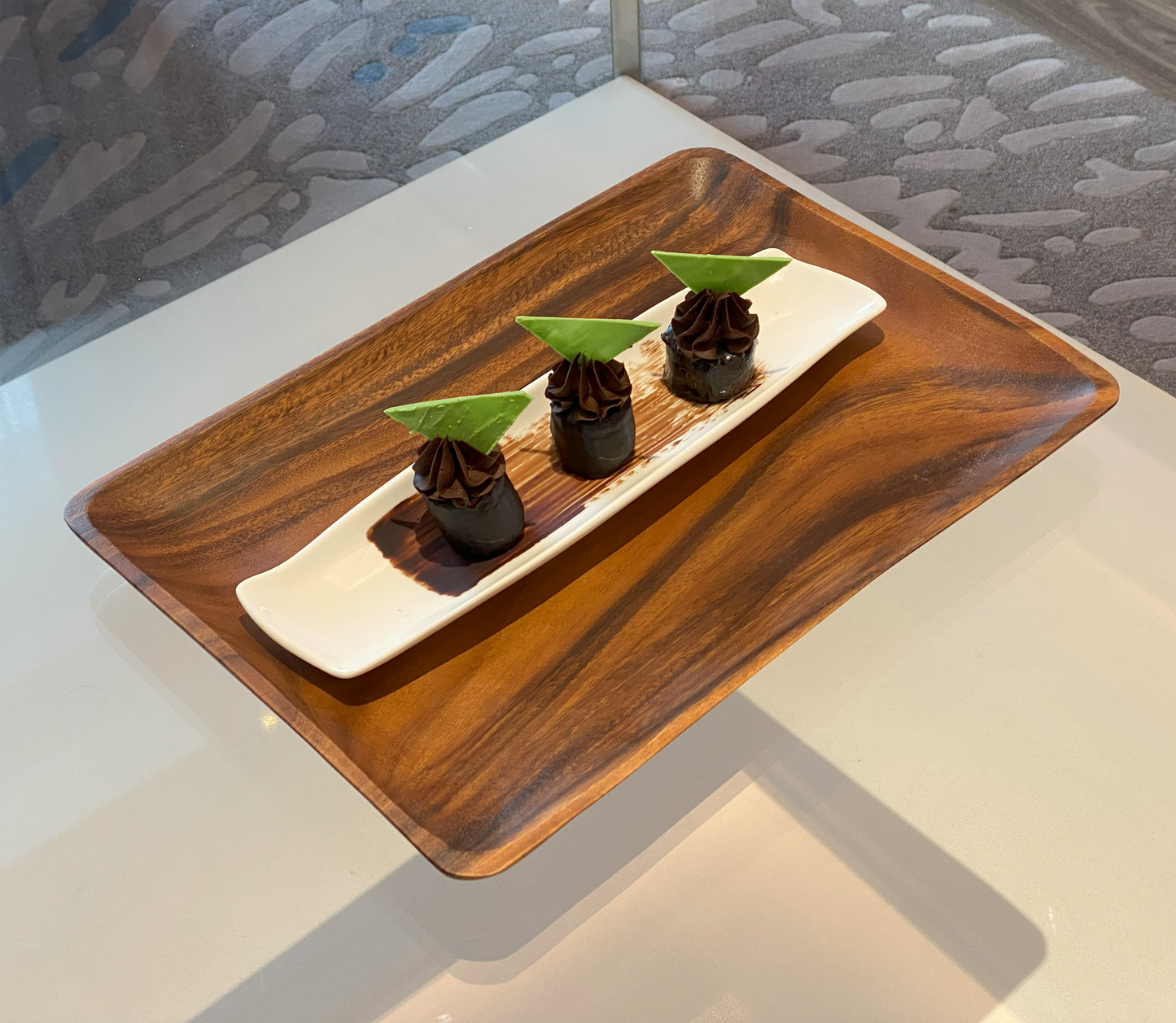 Wood serving tray with chocolate dessert bites