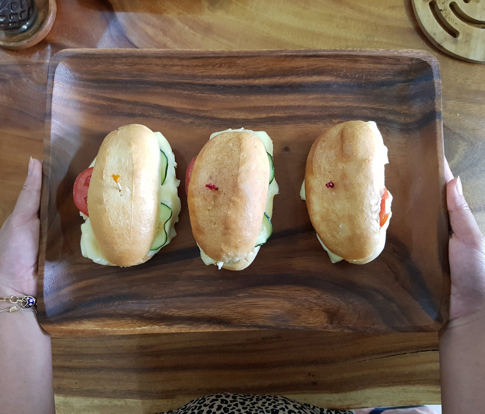 Wood serving tray with sandwiches
